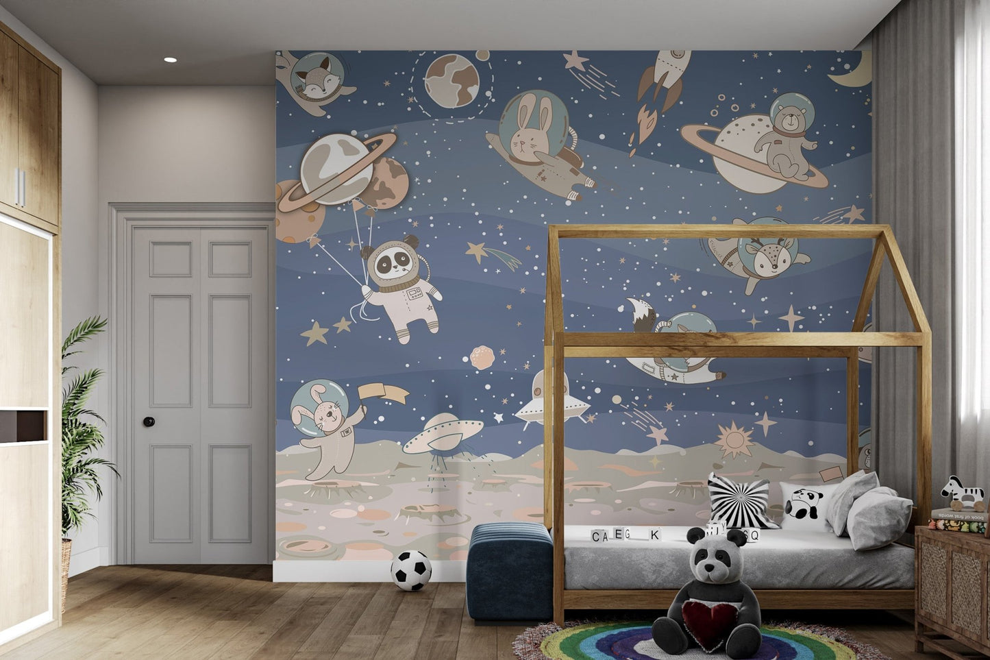 Lunar surface and stars featured on this blue space wall mural for kids bedroom.