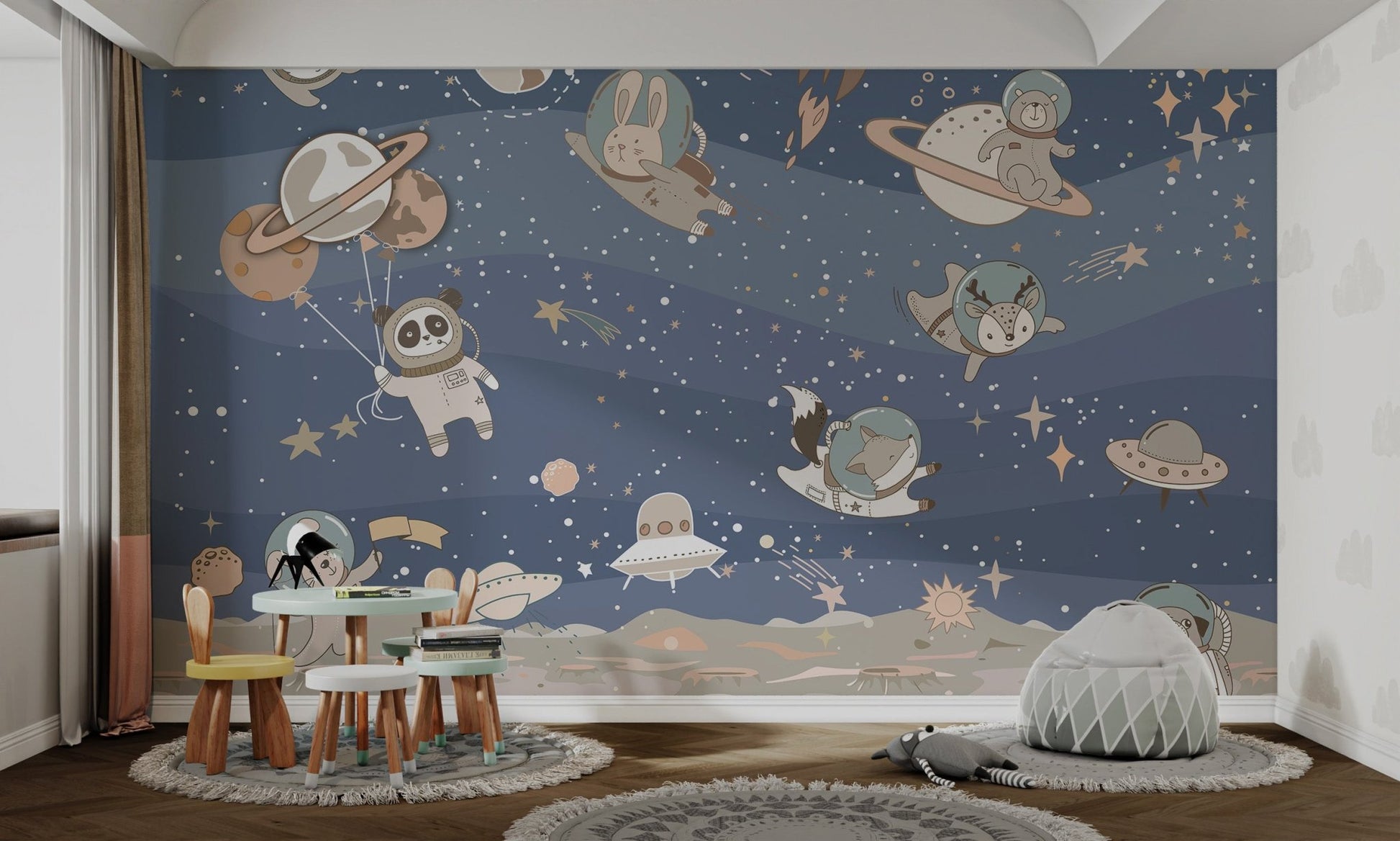 Cute blue mural with space animals floating joyfully for kids room.