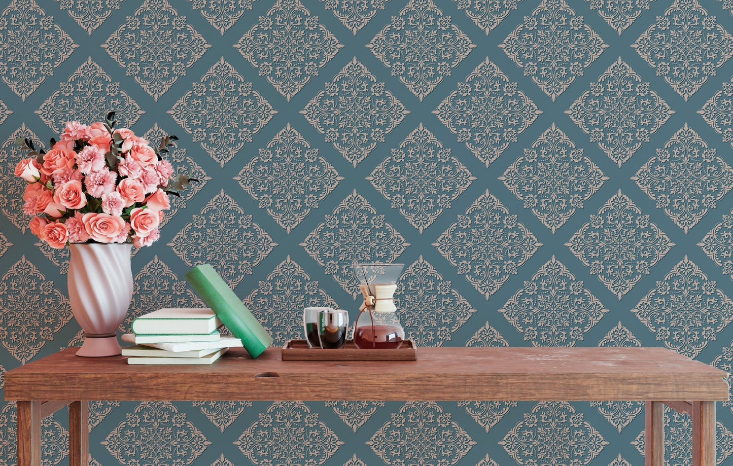 Blue patterned wallpaper in study area behind wooden table with flowers.