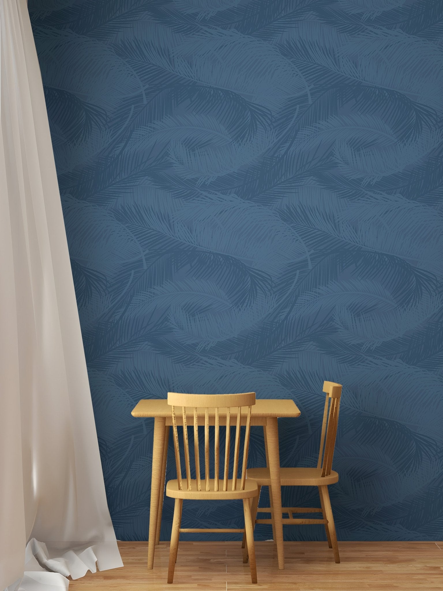 Navy blue leaf silhouette wallpaper in a dining nook with small wooden table.