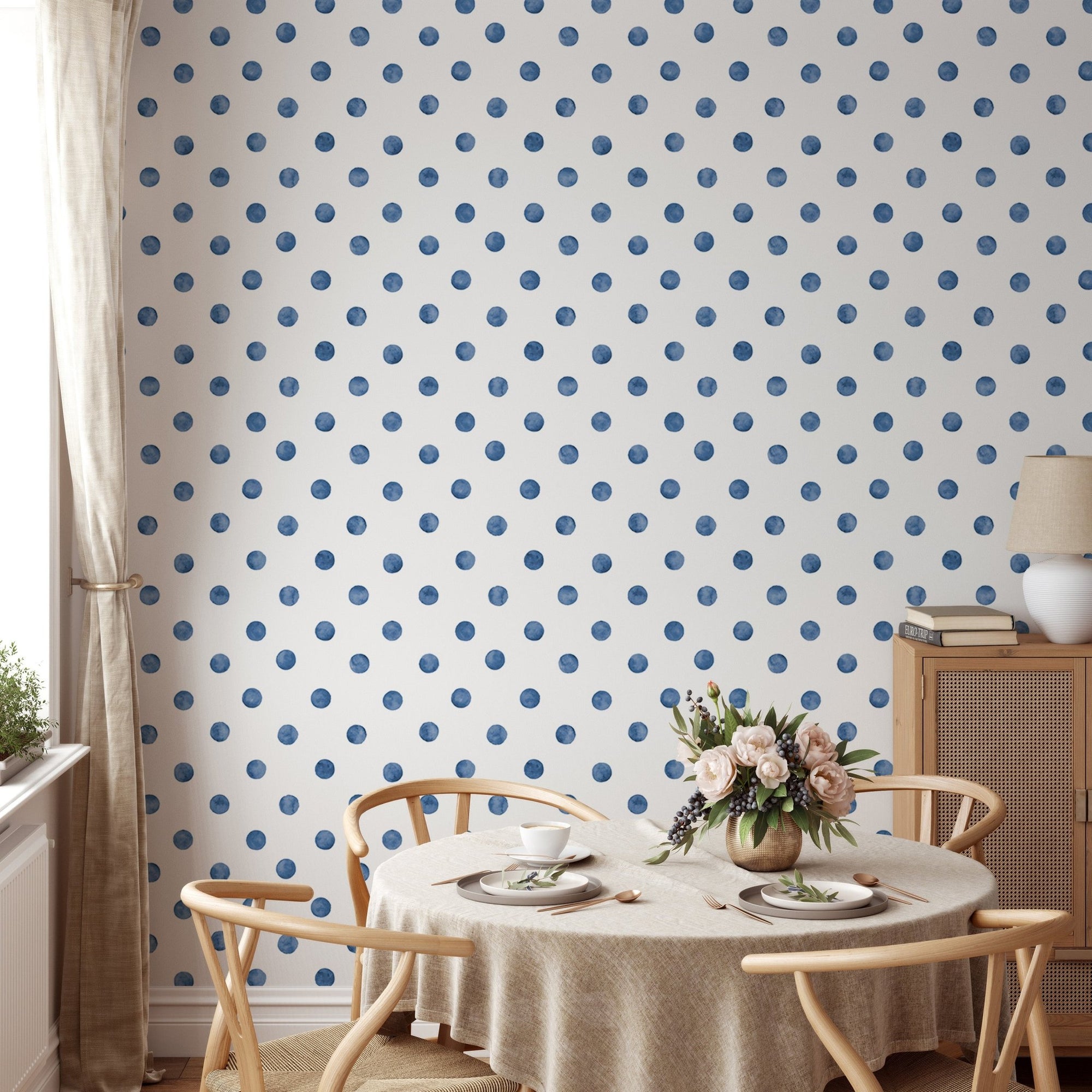Blue color polka dots indigo repeat pattern wallpaper in a dining room.