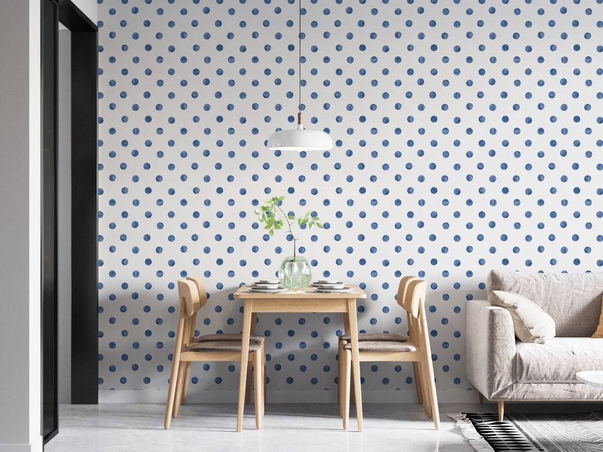 Indigo blue dotted wallpaper in a bright apartment dining area.
