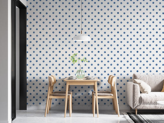 Indigo blue dotted wallpaper in a bright apartment dining area.