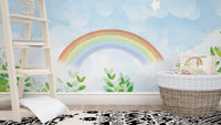 Whimsical watercolor rainbow wall mural for children's area.
