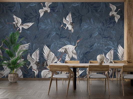 Sleek wall mural with soaring birds and cool blue leaves silhouettes.