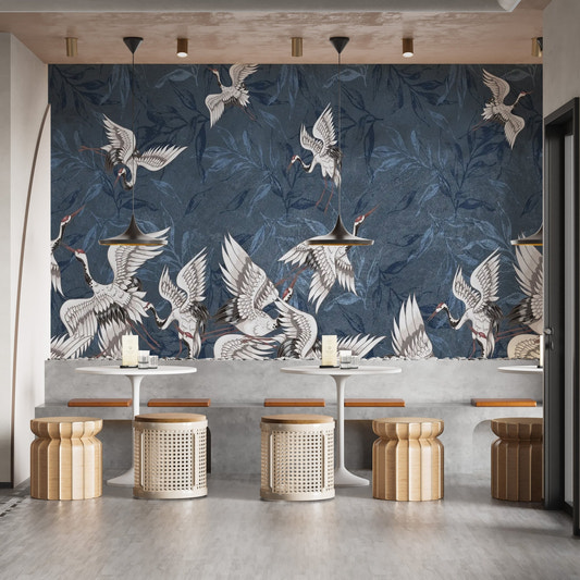 Blue gunge leaves crane wallpaper with white birds on textured navy background.