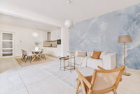 Soft blue marble wall mural with white quartz style streaks for home interior.