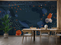 Abstract blue wall mural in a dining room with a long table and plants