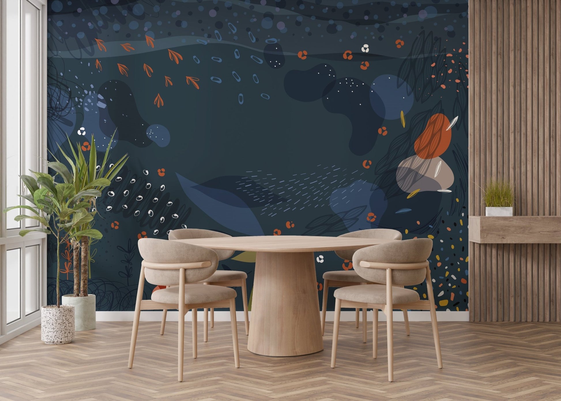 Round wooden dining table set against a blue modern abstract wall mural.