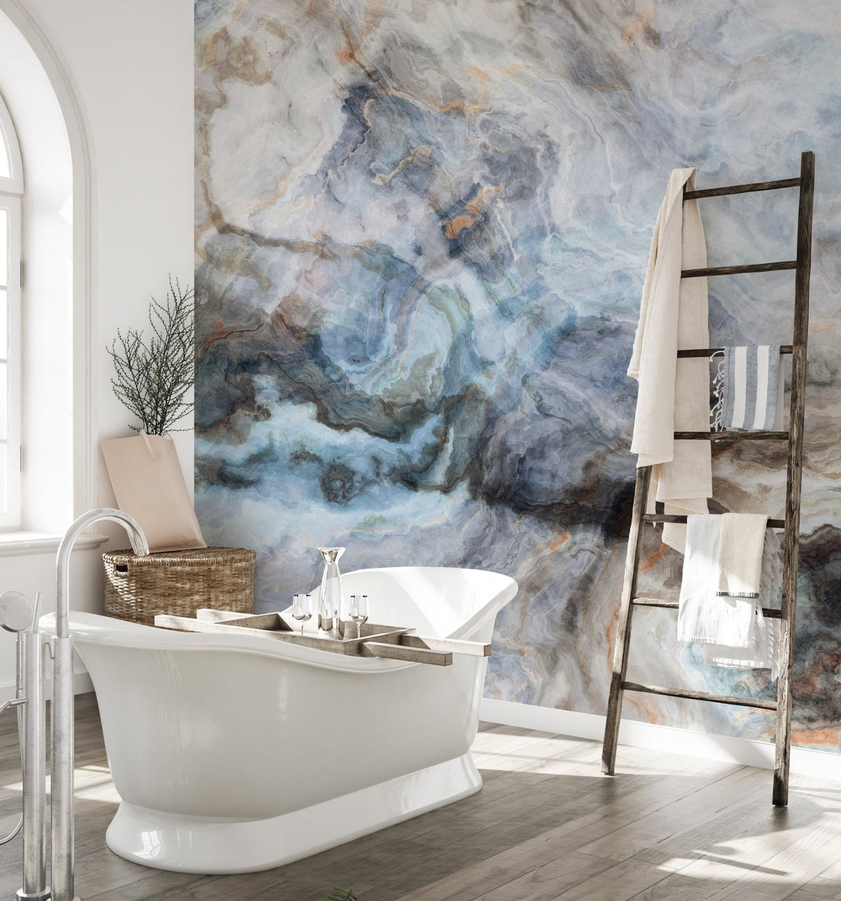 Bathroom wall mural featuring a white bathtub and abstract blue stone patterns.