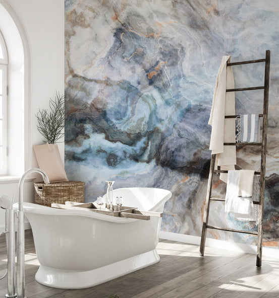 Bathroom wall mural featuring a white bathtub and abstract blue stone patterns.