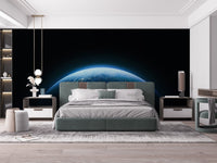 Blue planet wall mural with dark galaxy background.