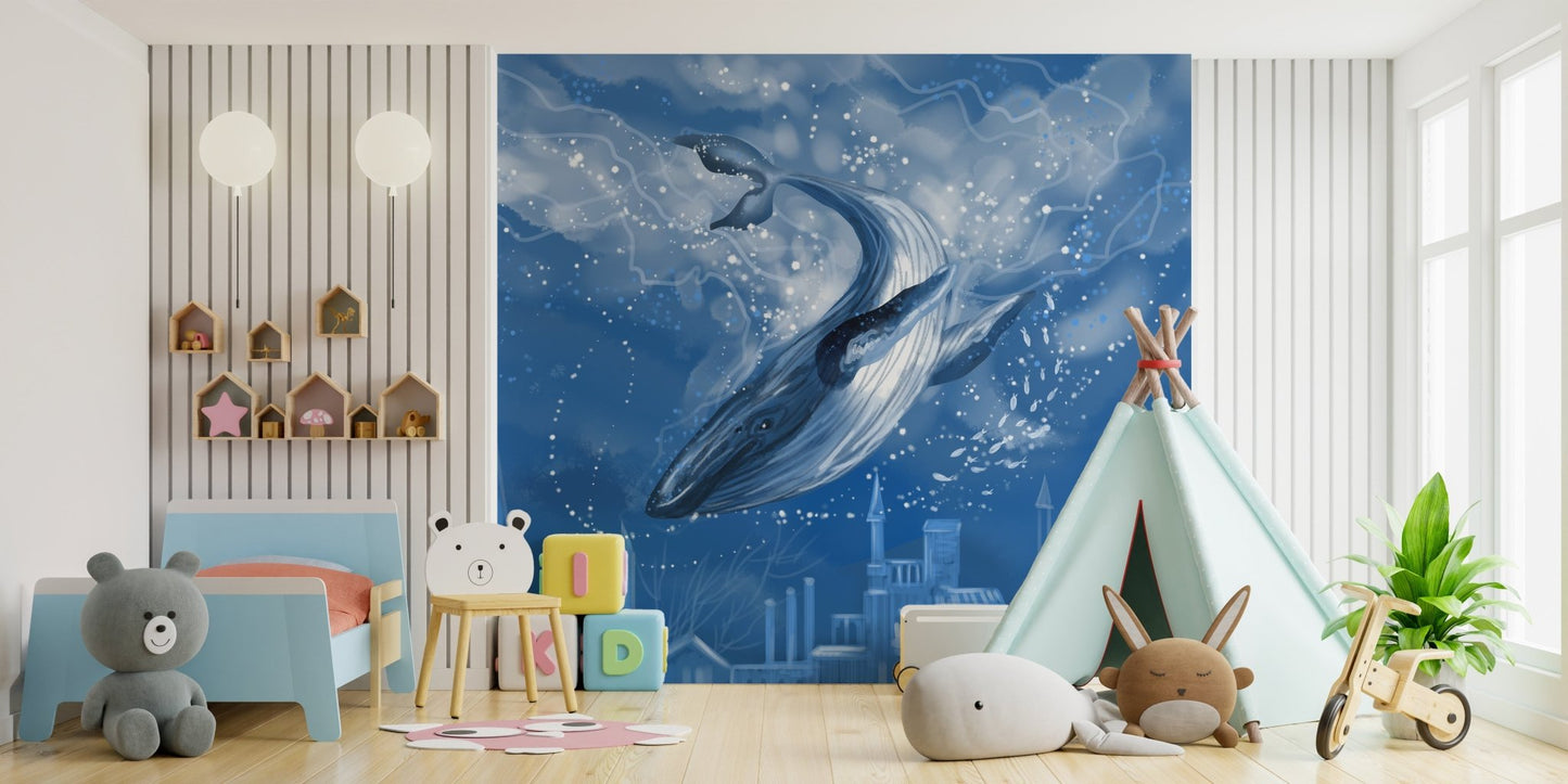 Large whale wallpaper mural behind a white play tent in a bright bedroom.
