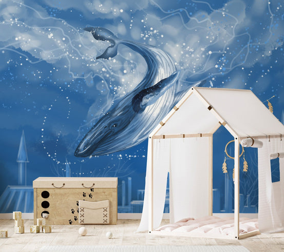 Blue aquatic wall mural behind a white dresser in a modern nursery.