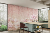Kitchen area with a light pink rose wall mural and a marble island.