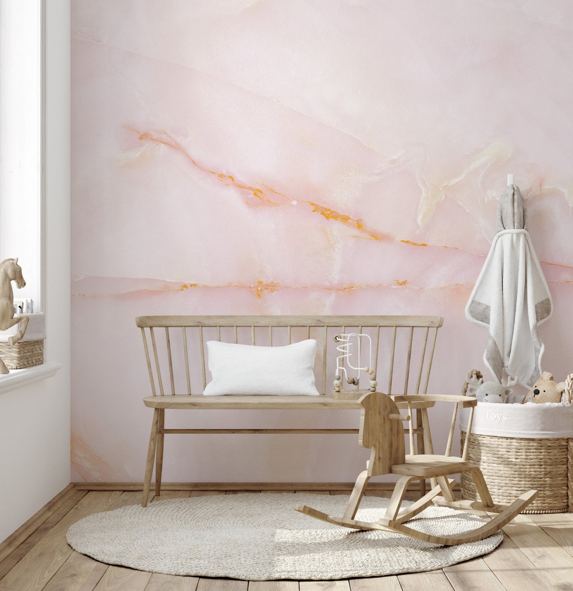 Artistic mural featuring blushing pink onyx marble textures in kids playroom.
