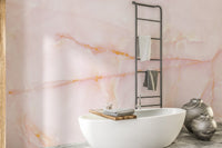 Blushing pink onyx marble mural for timeless and stylish bathroom decor.
