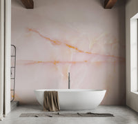Luxurious pink onyx mural blending elegance and natural patterns in bathroom.
