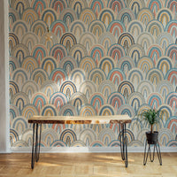 Living space patchwork wallpaper with terracotta and blue geometric shapes.