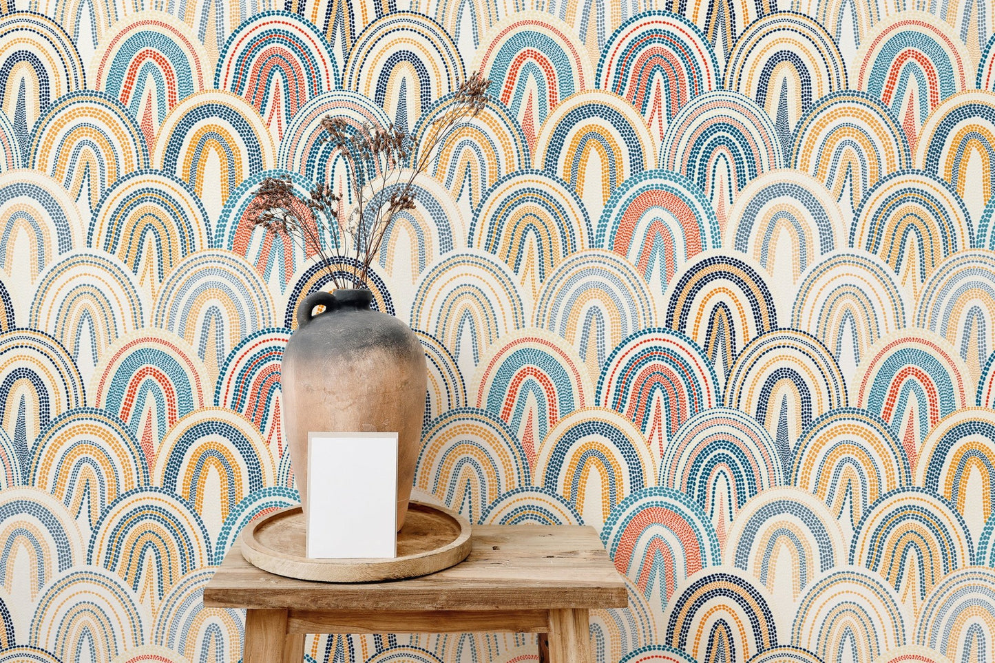 Multi-color scallop pattern wallpaper behind a wooden console table.
