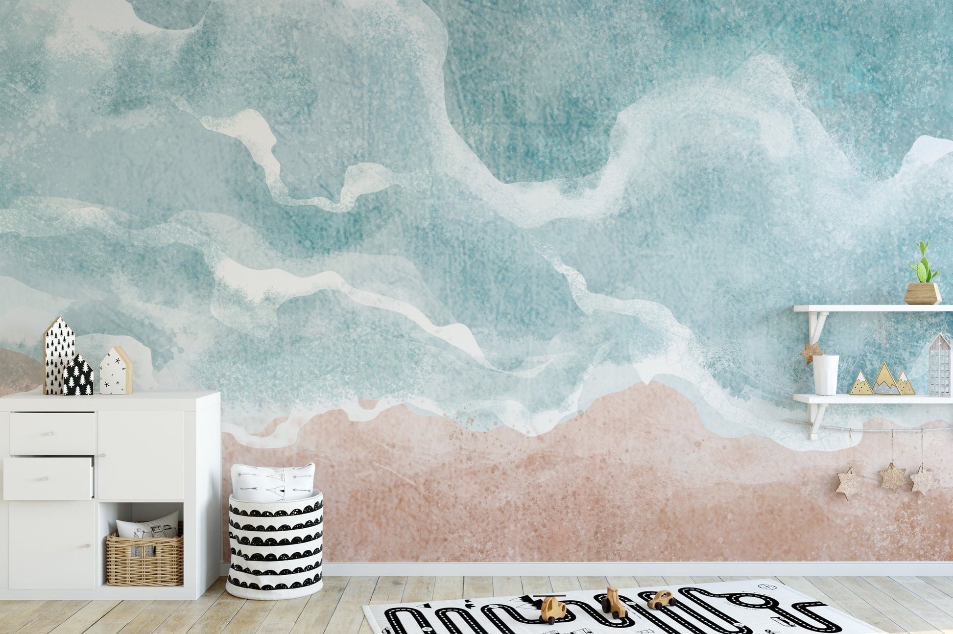 Artistic shoreline wall mural in muted aqua and warm sand shades.