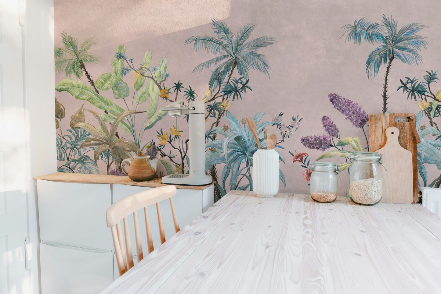 Kitchen dining area with pink botanical flower wall mural and wooden furniture.