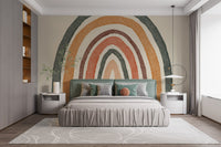 Cheerful rainbow mural in boho style for bedroom walls.
