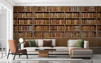 Bookish Nostalgia Wall Mural behind a grey L-shaped sofa and green cushions.