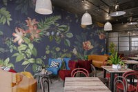 Patterned wall mural with pink roses and purple flowers on navy blue.