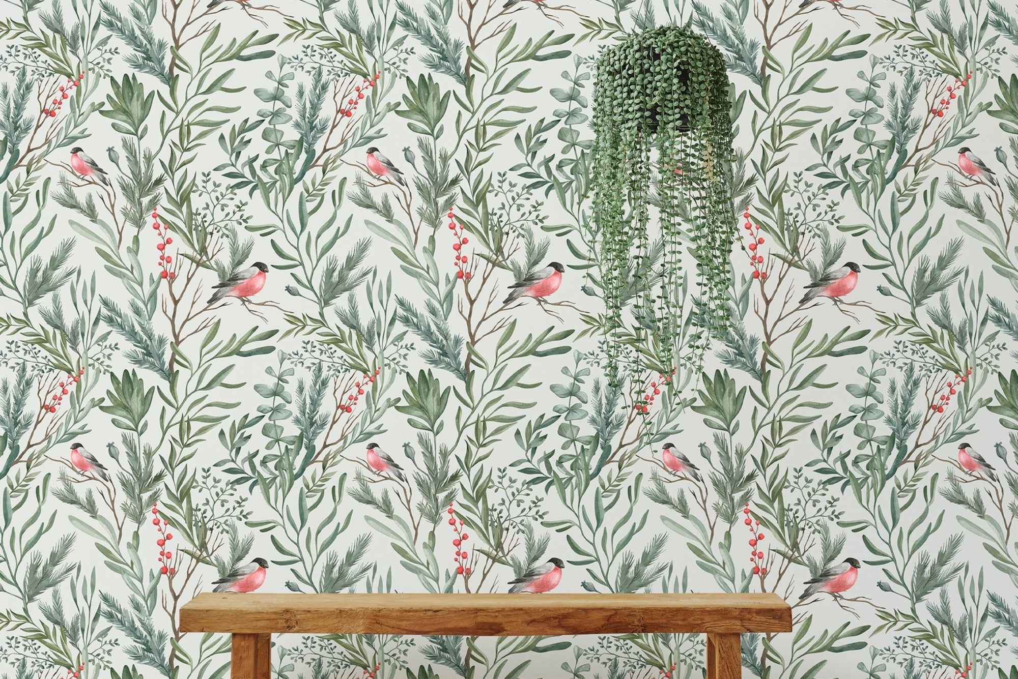 Botanical watercolor leaves bullfinch bird foliage wall mural behind a wooden bench.