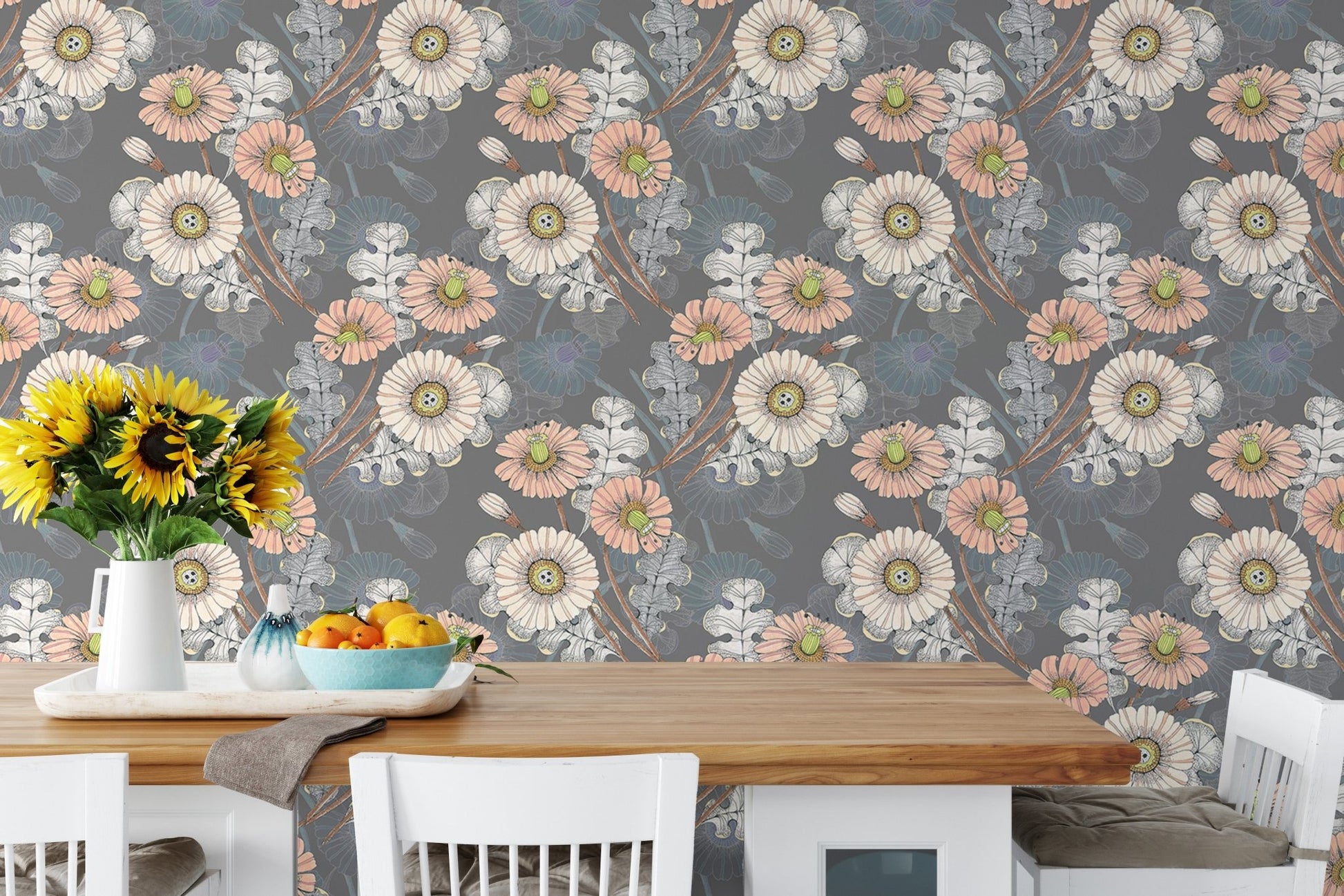 Vintage style bouquet wallpaper on a dining room wall with a white wooden table.