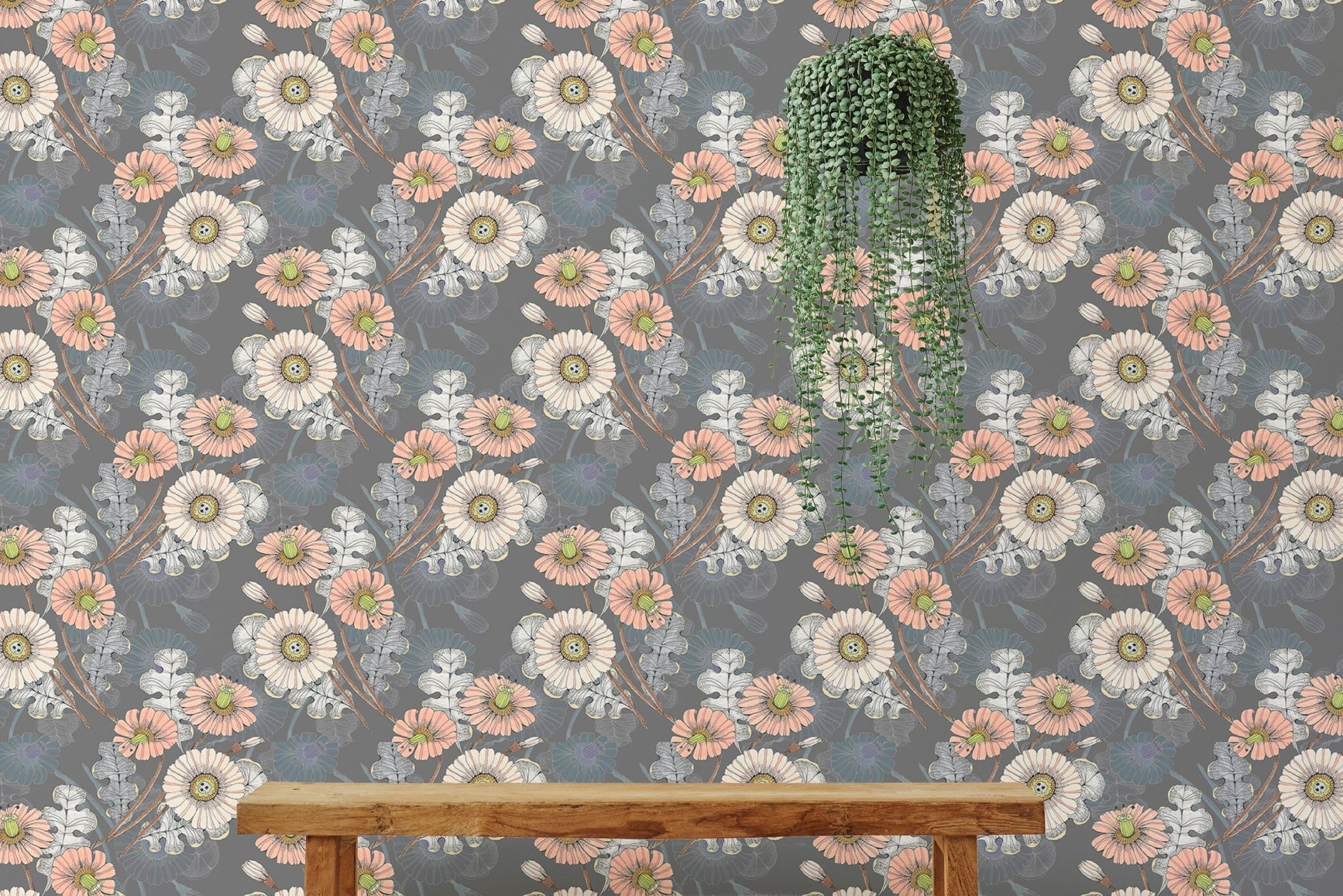 Large flower pattern wallpaper hanging in a bright open-plan living space.