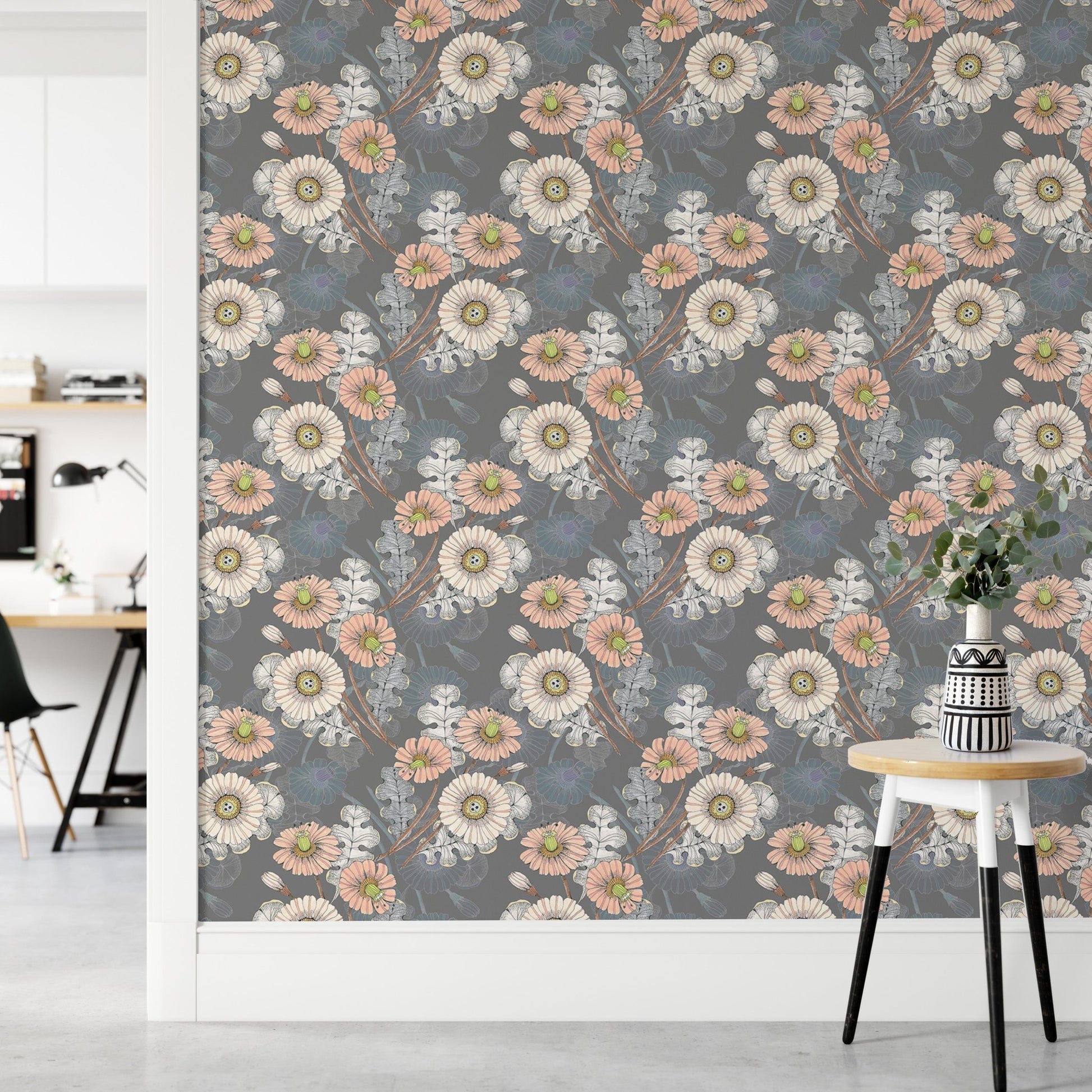 Decorative flowers drawing wallpaper in a hallway next to a small wooden stool.
