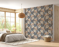 Floral bouquet wallpaper in a master bedroom with neutral bedding and wood accents.