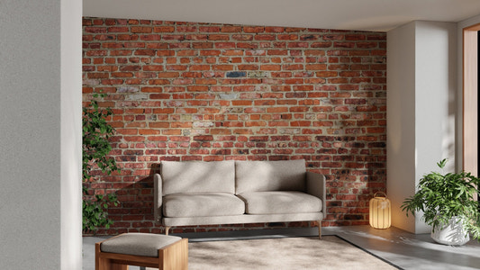 Industrial living area featuring red brick wall mural behind a tan sofa.