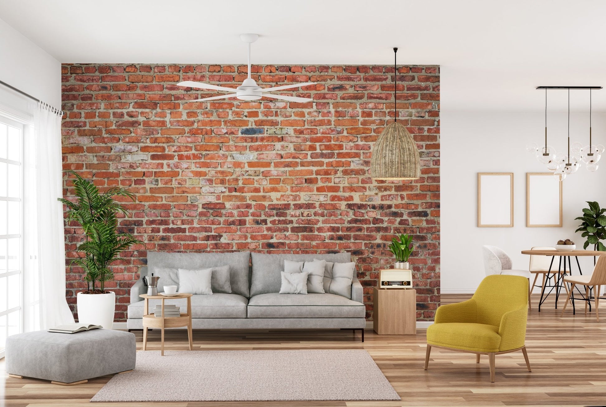 Modern living room with grey furniture and exposed red brick wall mural decor.