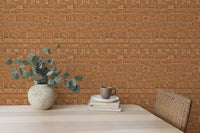 Pavement-style brown brick texture wallpaper behind table and chair.