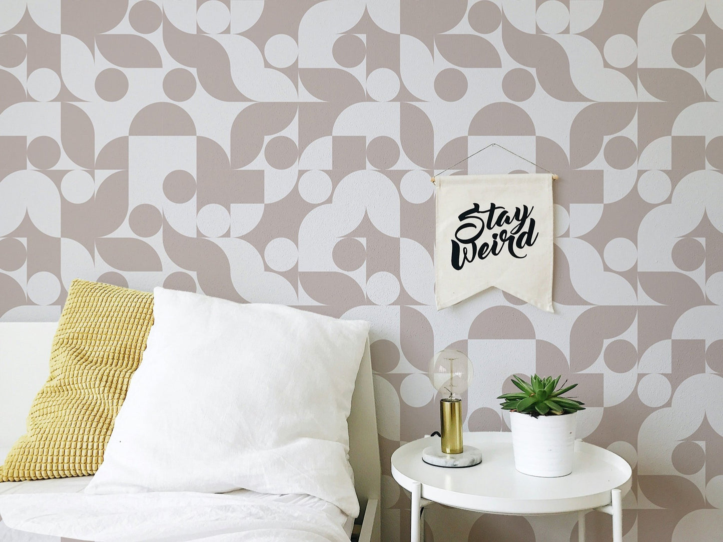 Brown abstract vector geometric wall mural in a nursery with light wood furniture.