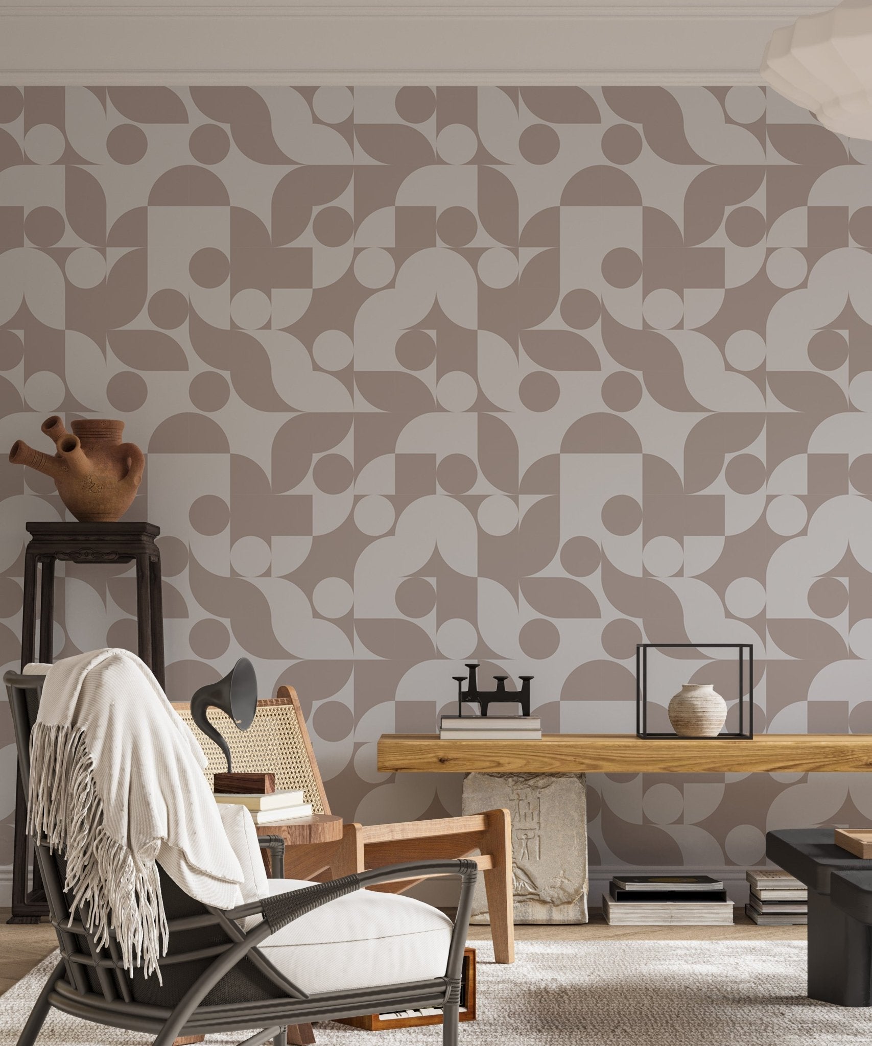 Abstract geometric wall mural in brown and cream behind a white storage unit.