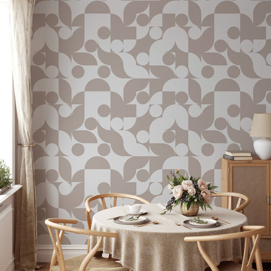 Geometric wall mural with scandi art patterns near a wooden dining table.