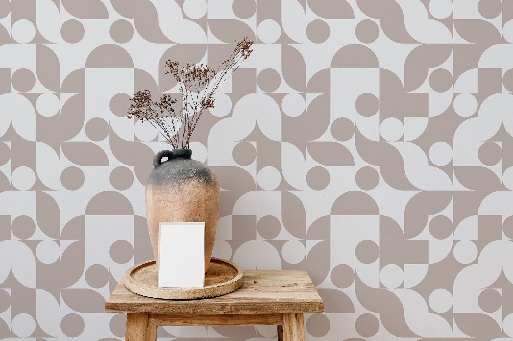 Brown abstract vector geometric wall mural behind a wooden shelf in a hallway.