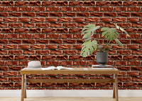 Modern living space featuring a brown brick wallpaper behind a long wooden bench.