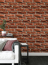 Brown color brick wall texture wallpaper in a living area with a white couch.