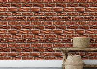 Brown color brick wall texture wallpaper behind a wooden bench with woven baskets.
