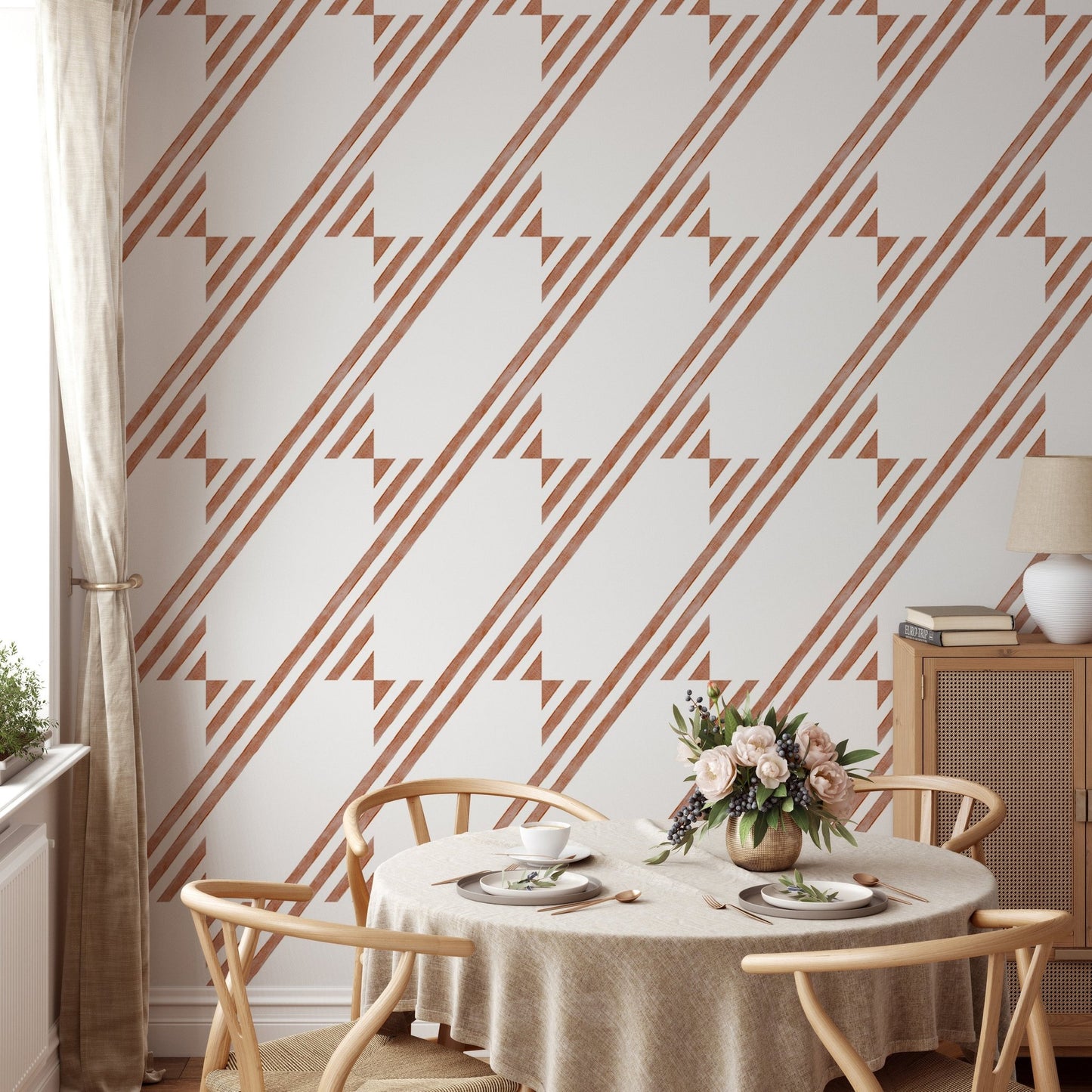 Dining room featuring brown diagonal stripe wallpaper and circular wooden table.