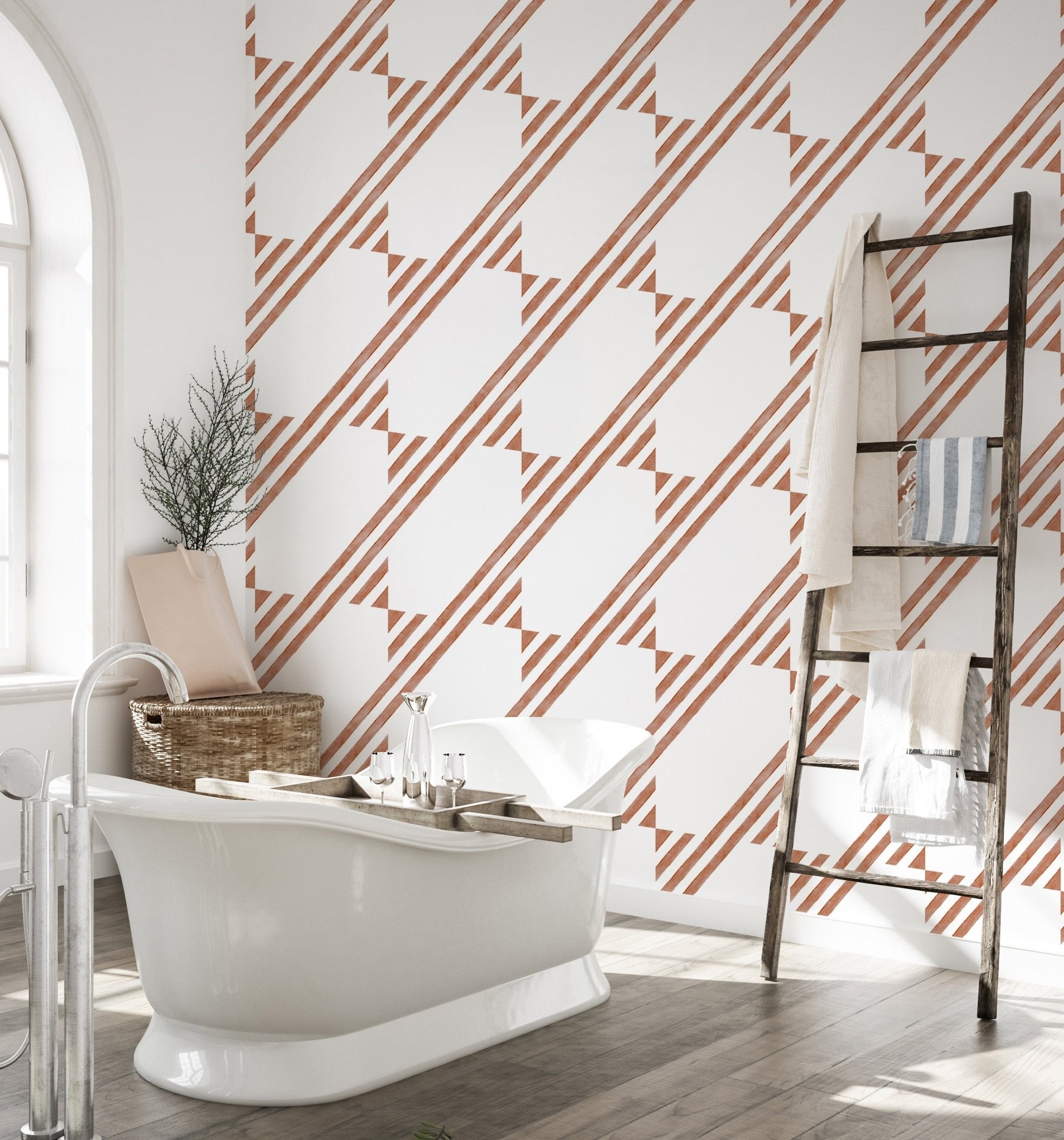 Bathroom interior with brown diagonal stripe wallpaper and a freestanding tub.
