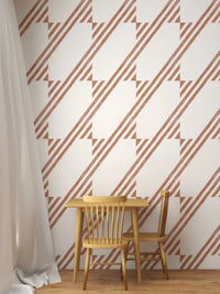 Brown diagonal stripe wallpaper in a dining area with a small wooden table.