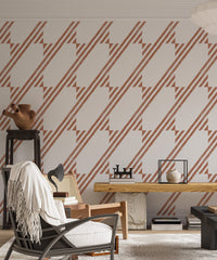 Minimalist living area with brown geometric wallpaper and a leather chair.