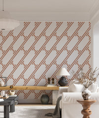 Geometric stripe wallpaper with brown lattice pattern behind a living room sofa.