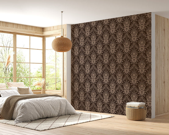 Bedroom interior with brown damask wallpaper behind a wooden bed frame.
